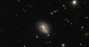 Хаббл запечатлел столкновение двух спиральных галактик